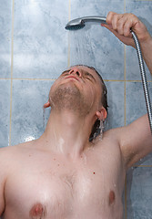 Image showing Man taking shower