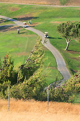 Image showing Golfers in Golf Carts