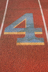 Image showing Number Four on a Running Lane