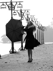 Image showing Blonde with umbrella on promenade