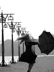 Image showing Blonde with umbrella on promenade