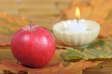 Image showing Red apple from candles on a background