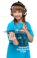 Image showing Girl in earphone with vinyl disk