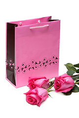 Image showing Rose gift package and three roses