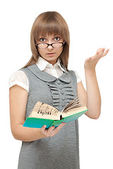 Image showing Young girl reads english and is amazed