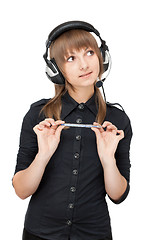 Image showing Beautiful girl in earphone and pencil