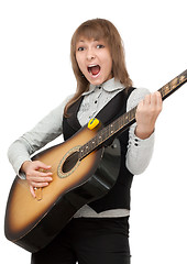 Image showing Girl with guitar in hand expressive sings