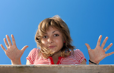 Image showing Young beautiful girl shows palm