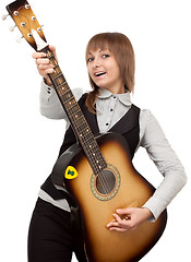 Image showing Young girl with guitar sings