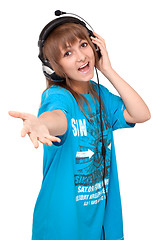 Image showing Young girl in earphone sings