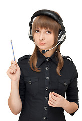 Image showing Grl in earphone with mike, pencil in hand