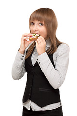 Image showing Young girl eats sandwich