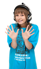 Image showing Girl in earphone shows palm