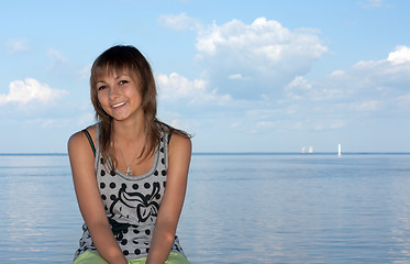 Image showing Girl on background sky, sea and sailfish