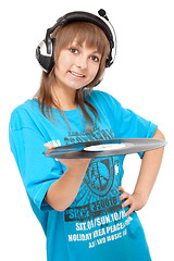 Image showing Girl in earphone with vinyl disk in hand smiles