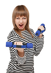 Image showing Young girl with dumbbell yells