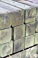 Image showing Stack of wooden posts