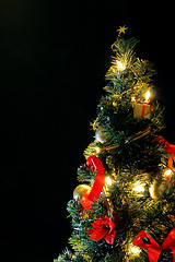 Image showing christmas tree decorated in red and gold