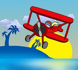 Image showing Sunset with biplane