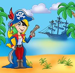 Image showing Pirate girl on beach 2