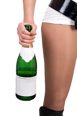 Image showing Young woman with a champagne bottle. Isolated