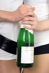 Image showing Two girls with a champagne bottle in a hands