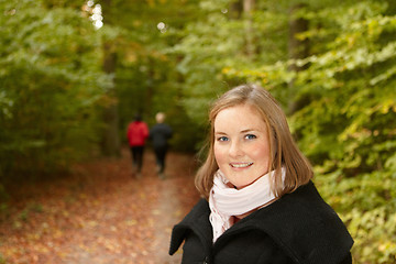 Image showing Autumn - Woman in forest smiling 