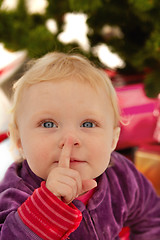 Image showing Cute baby saying shhh - at christmas