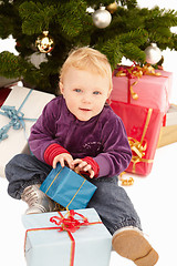 Image showing Christmas - Cute child opening gifts 