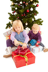 Image showing Christmas - Cute young girls opening their presents