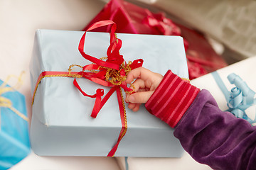 Image showing Christmas time -  opening of presents