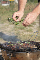 Image showing preparing grilled fishes 