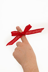 Image showing Pointing a ribbon on a finger
