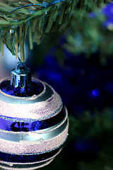 Image showing Christmas ornaments on tree.