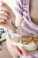 Image showing Young people eating milk with cereals