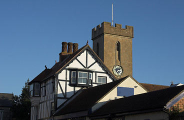 Image showing church clock tower with timber building