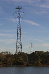 Image showing Electricity pylons over river