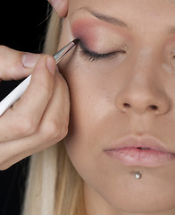 Image showing Applying professional make up