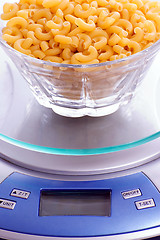 Image showing Macaroni Noodles Being Weighed