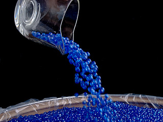 Image showing Pouring Plastic Colored Beads