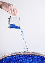 Image showing Pouring Plastic Colored Beads