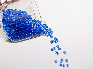 Image showing Pouring Plastic Colored Beads