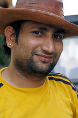 Image showing Smiling Indian man with a cowboy hat