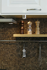 Image showing Close up to a kitchen wall with utensils on it