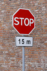 Image showing Stop sign cautioning drivers to stop in 15 meters