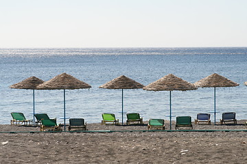 Image showing Beach with chairs and umbrellas, Santorini island, Greece