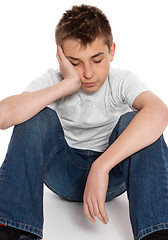 Image showing Bored, lonely, tired, depressed boy sitting