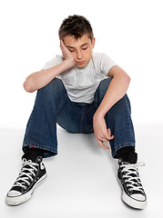 Image showing Sad, loney, depressed or listless boy sitting