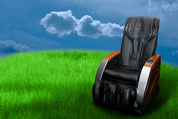 Image showing massage arm-chair on the green grass