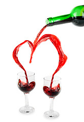 Image showing Heart from pouring red wine